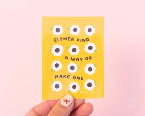 Cute yellow vinyl sticker illustrated with flowers and the text "Either find a way or make one"